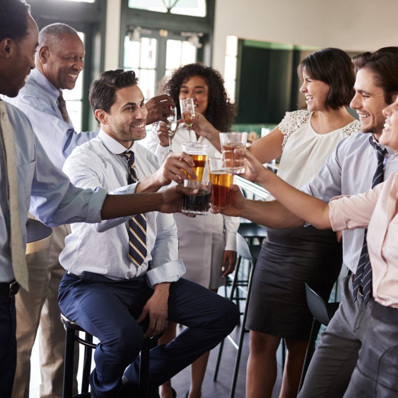 Business Colleagues Meeting For After Works Drinks In Bar Making A Toast